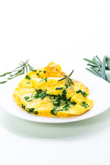 hot fried omelet with chopped green onions in a plate