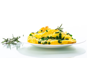 hot fried omelet with chopped green onions in a plate