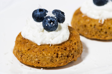 pumpkin cakes with cream and blueberries, closeup