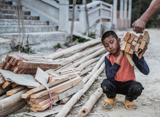 Children are forced to work in construction areas. Human rights concepts, December 10 Stop child abuse, violence, fear of child labor and human trafficking.