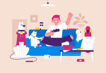 The boy is sitting on the couch and playing video games