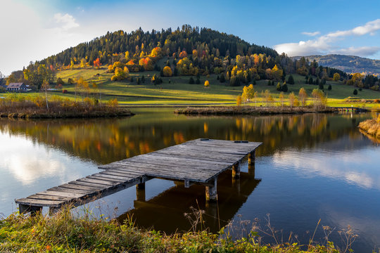 autumn pond under the mountains, Murau district,.Styria, Austria