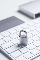 Finance. Security. Bank card with lock and key on a white table. Data security