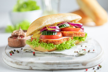 Savory sandwich with roasted pork neck, cucumber and onion