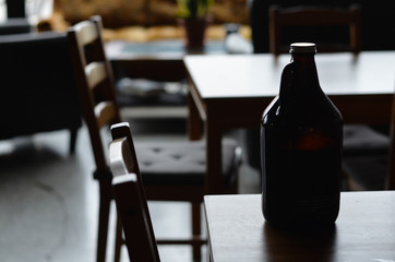 bottle at empty cafe table