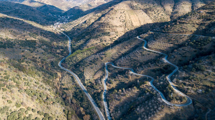 cloudy sky and narrow mountain road