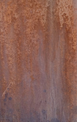 The surface is painted rust. Rusted metal wall. Metal rust background .Grunge rusty metal texture 