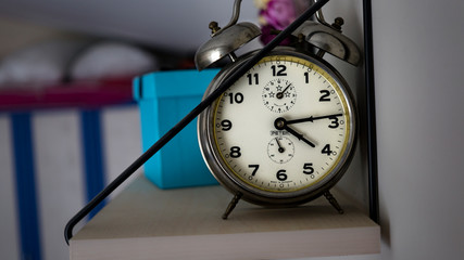retro desk clock at the shelf