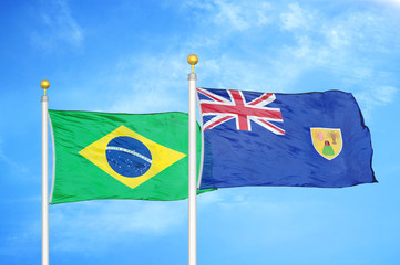 Brazil and Turks and Caicos Islands two flags on flagpoles and blue cloudy sky