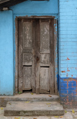 Weathered door in an old house in Kumrokhali, West Bengal, India