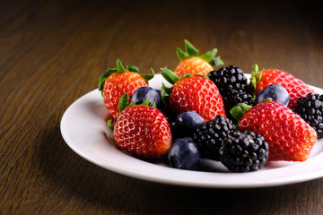 fresh berry fruits in a bowl on table