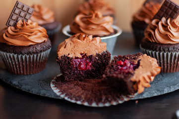 Chocolate cupcakes with chocolate cream on top