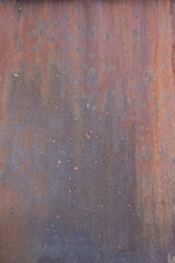 Metal rust background. The surface is painted rust. Rusted metal wall. Grunge rusty metal texture 
