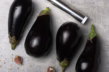 Fresh raw Eggplant, foil, garlic. Recipe ingredient. Top view.