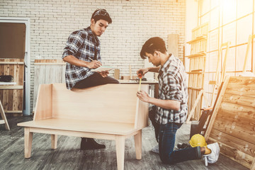 Carpenter working on wood craft at workshop to produce construction material or wooden furniture....