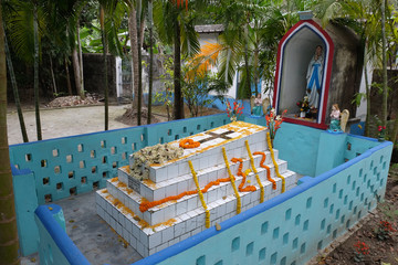 Fototapeta na wymiar The tomb of a Croatian missionary, Jesuit father Ante Gabric, decorated on the occasion of his 105th birthday in Kumrokhali, West Bengal, India