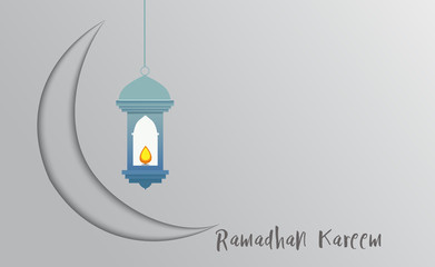 Light blue Morocco lantern  with fire inside it  and moon against soft gray gradient background.