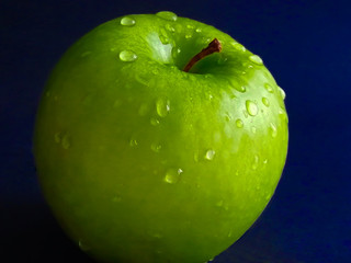 Green Apple on a dark background