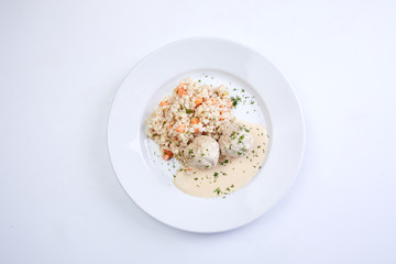 meatballs with barley on the white plate