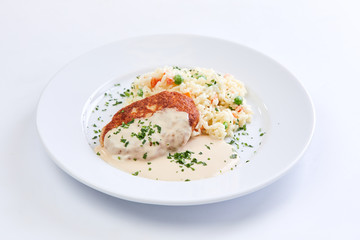 cutlet with rice and vegetables on the white background