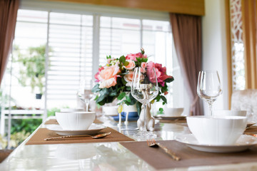 Dishes and the silverware on the dining table 