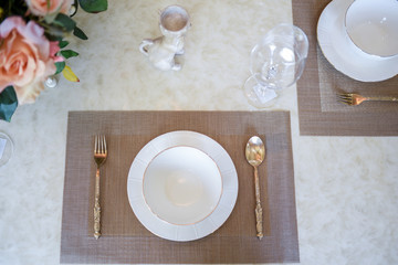 Dishes and the silverware on the dining table 