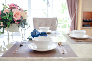 Dishes and the silverware on the dining table 