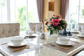 Dishes and the silverware on the dining table 