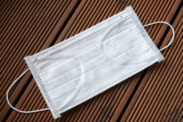 Coronavirus. unused children's medical mask on a wooden table