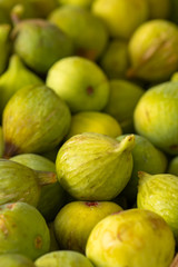Fresh ripe yellow figs at farmers market close up