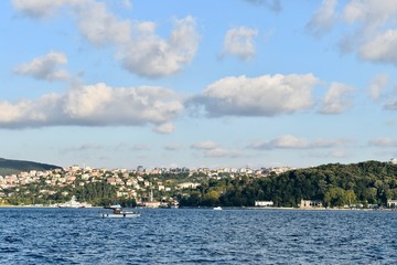Fototapeta na wymiar Small boat crossing Istanbul Bosporus