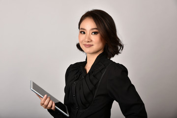 Confident business asian woman isolated in studio shot, Portrait of professional working people holding tablet computer with copy space.