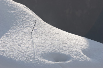 The car was covered with pure white snow.
