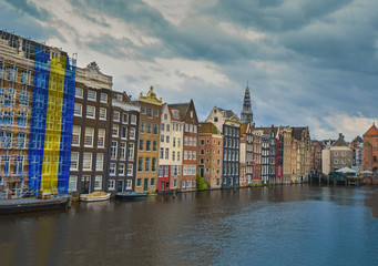 Naklejka premium A Beautiful City View Of Amsterdam In Netherlands. Amsterdam Is Referred To As Venice Of The North Due To Its Large Number Of Canals