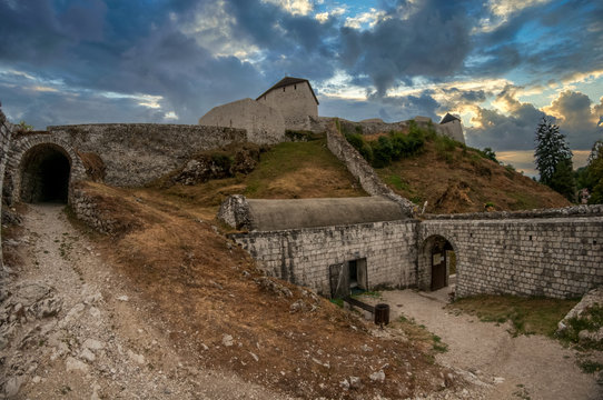 Tesanj castle from the Ottoman period with fortified gate, cannot tower with dramatic sky in Bosnia Herzegovina