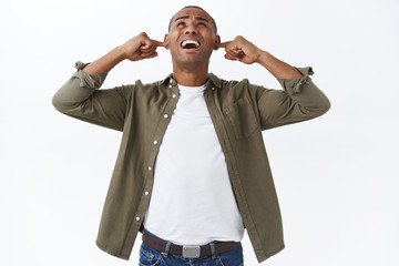 Portrait of complaining annoyed african-american man, shouting at neihbours upstairs, complaining...