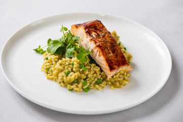 Green peas risotto with grilled salmon