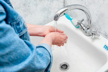 Woman Very Carefully Washing Hand with Soap During Epidemic Coronavirus