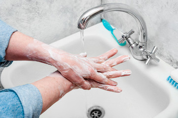 Woman Very Carefully Washing Hand with Soap During Epidemic Coronavirus