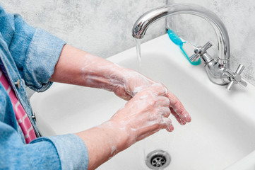 Woman Very Carefully Washing Hand with Soap During Epidemic Coronavirus