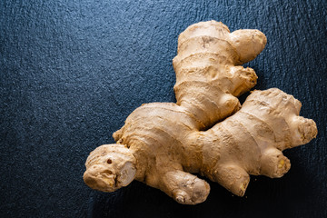 Ginger on black stone background