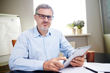 businessman with pc tablet in office