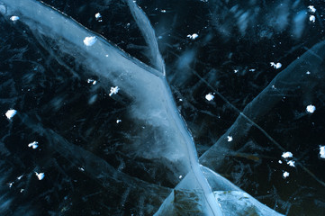 Top view white flakes of snow lie on the ice