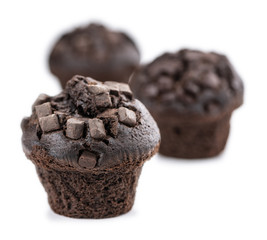 Some Chocolate Muffins isolated on white (selective focus)