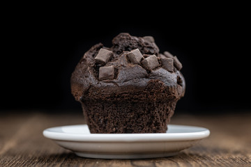 Chocolate Muffins (selective focus; detailed close-up shot)