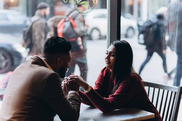 Young loving couple in cafe together. Love, family concept
