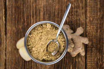 Some fresh Ginger Powder (selective focus; close-up shot)