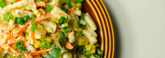 Cavatelli pasta with  iceberg lettuce, carrots, sweet corn, cucumber and chive in a sauce mayonnaise