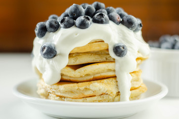 Delicious pancakes with sweet creamy yogurt and fresh berries