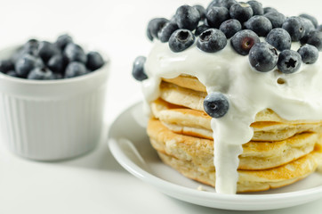 Delicious pancakes with sweet creamy yogurt and fresh berries